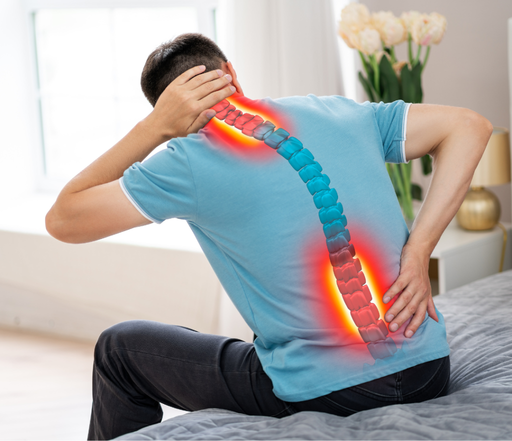 Person sitting on bed with a graphic of spine showing red areas suggestion they are going to be looking for pain relief for a slipped disc.