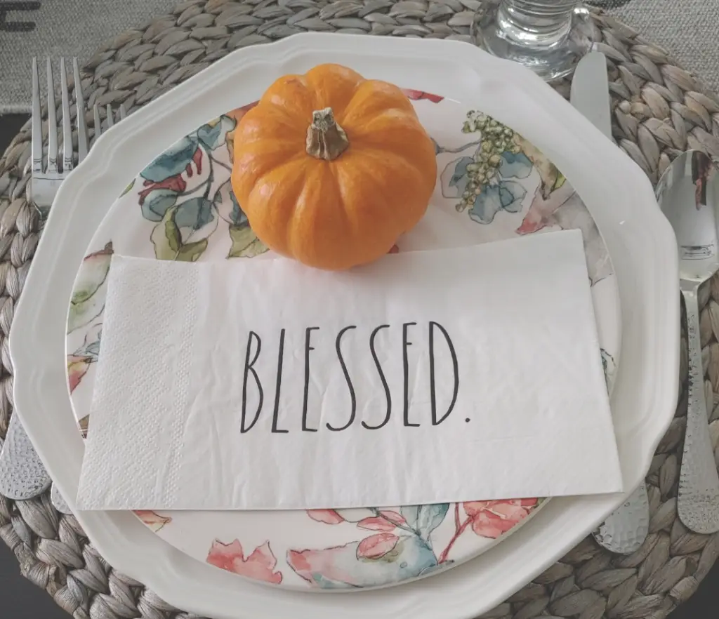 Table place setting with a serviette that says 'Blessed,' symbolizing the gift of gratitude in London Ontario and its connection to enhanced well-being with chiropractic care.